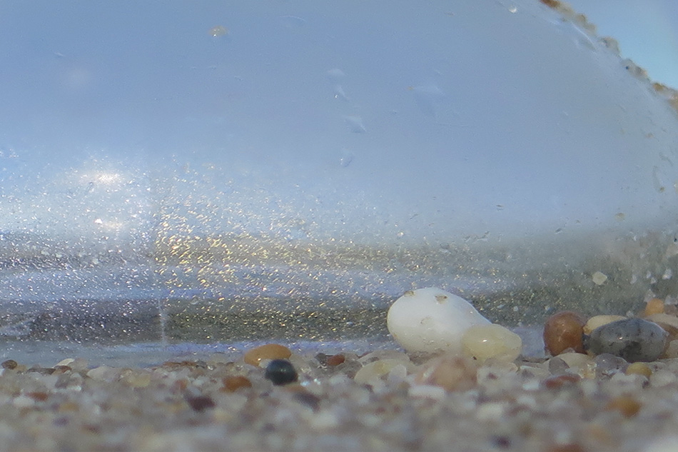 Handblown glass orbs in the forest, pond, and on the shore